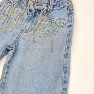 Calça jeans infantil wide leg com strass